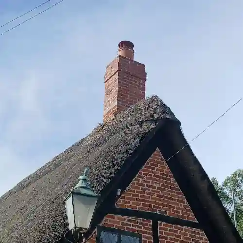 Chimney stack repair on a thatched cottage